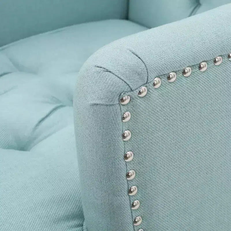 Fauteuil Club avec dossier capitonné et clous décoratifs