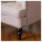 Fauteuil Club avec dossier capitonné et clous décoratifs